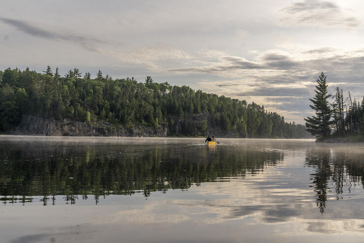 A lifting mist on Hamburg Lake, Quetico. Plan your own magical trip with the help of an experienced outfitter. Â Photo: David Jackson