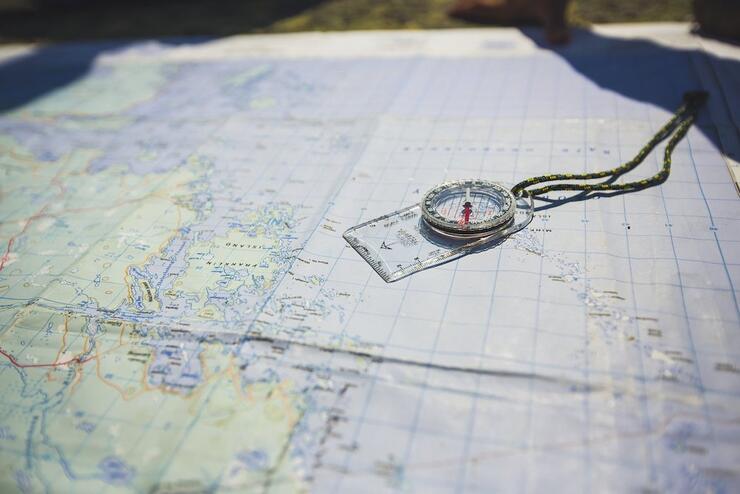 Compass sitting on a map