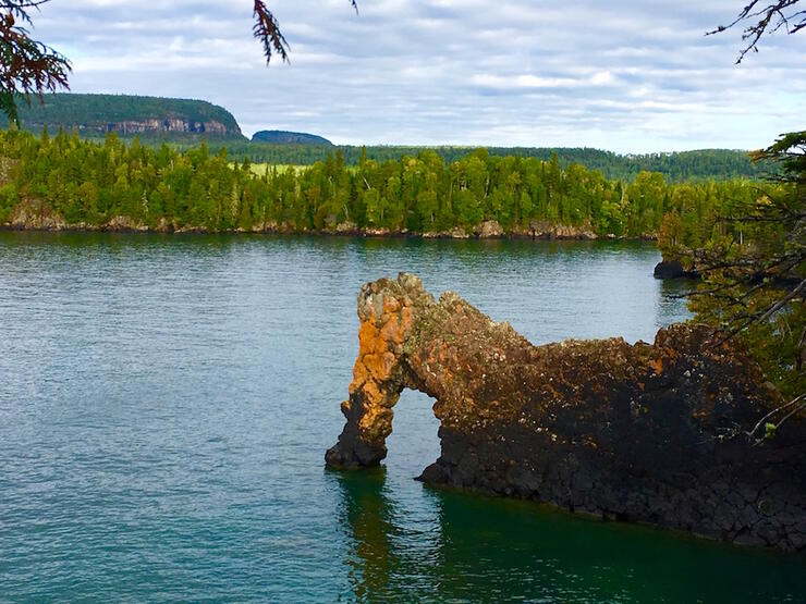 A interesting rock formation on a lake. 