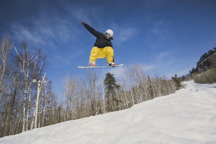 Person on a snowboard catching air.