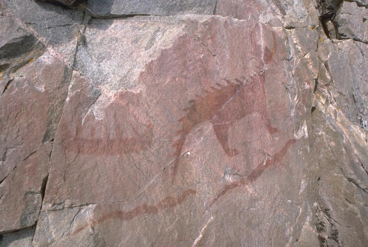 Red pictograph on rock wall 