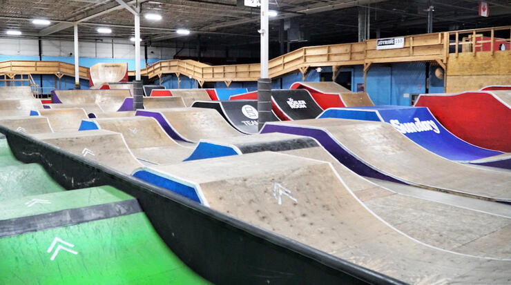 Numerous pump tracks inside a large building