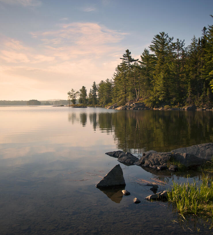 View of calm lake at sunset 