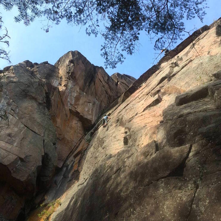 Looking up at a rock face.