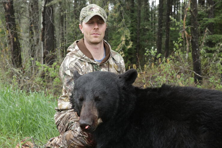 hunter with ontario black bear