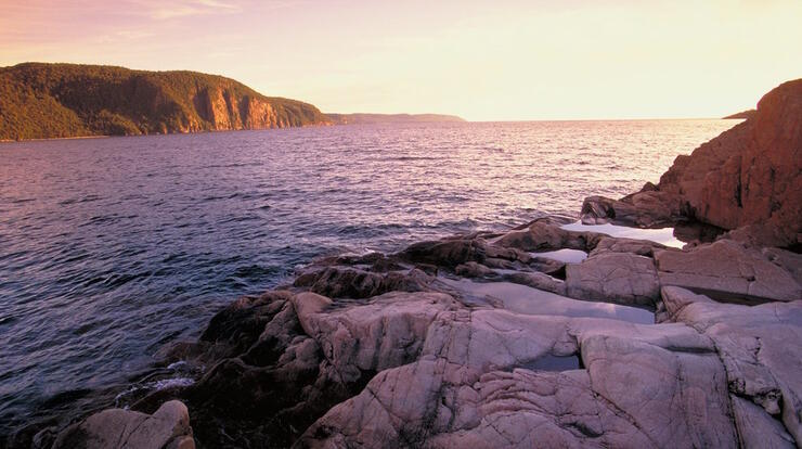 View of Lake Superior at sunrise with steep rocky cliffs 