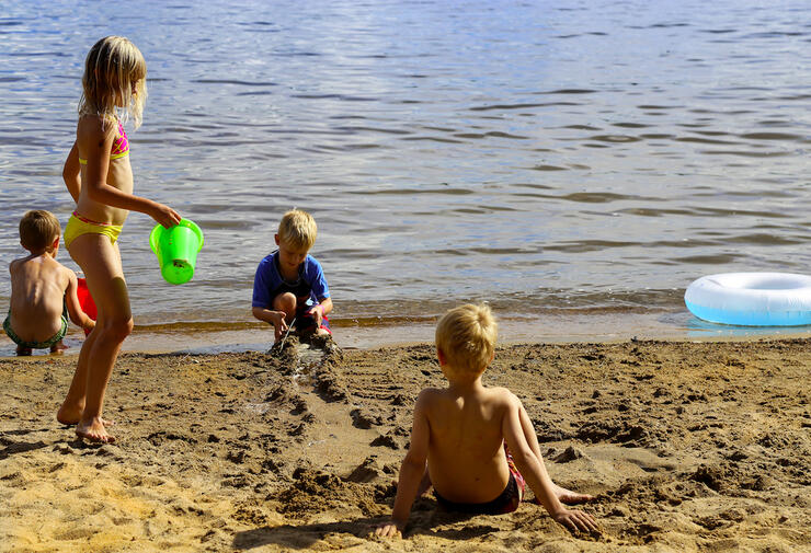 Group of kids playing on a sandy beach
