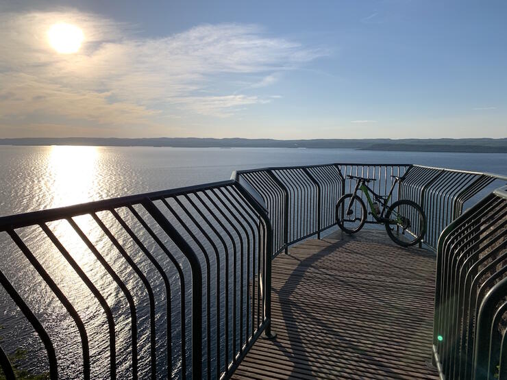 Bicycle parked on a wooden lookout overlooking Lake Superior.
