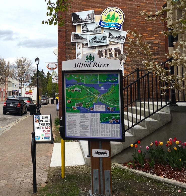 Sign showing map of Blind River trails. 