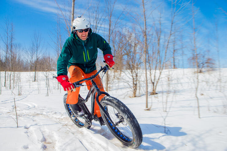Man in winter gear on fat bike