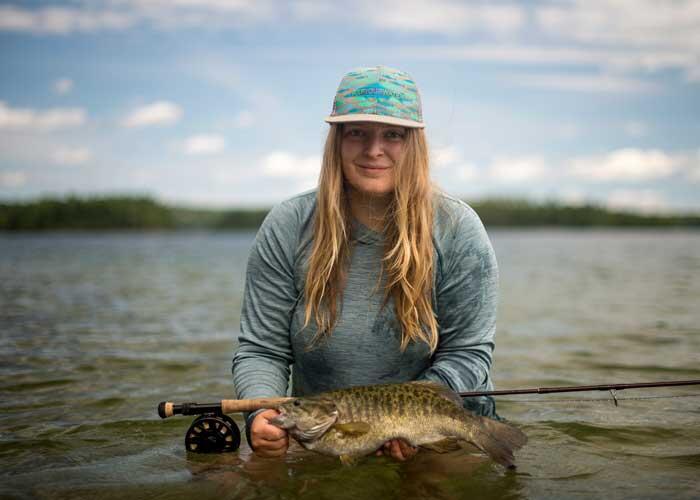 woman angler with smallmouth bass
