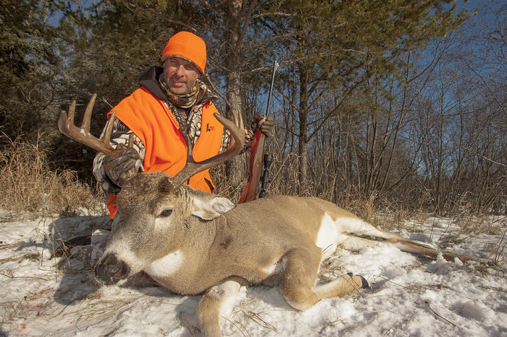 hunter with harvested deer