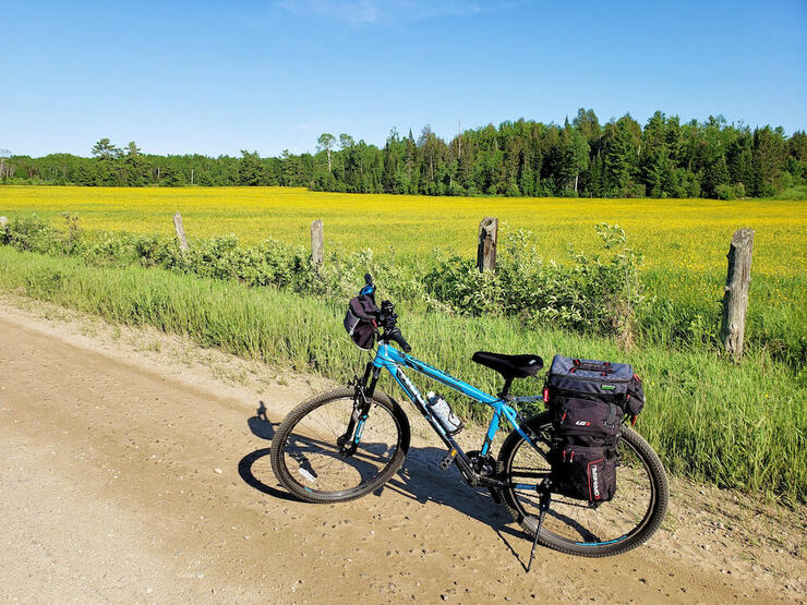 Bike parked on kickstand on a country dirt road
