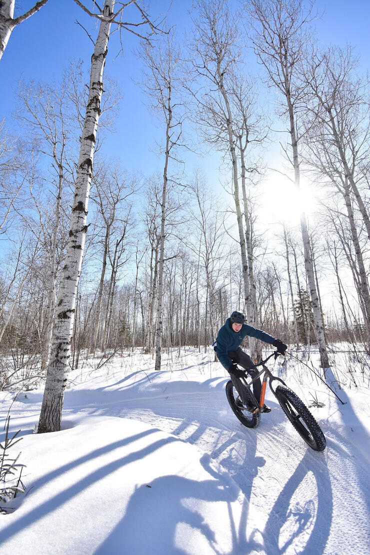 person cycling in winter at Walden Trails Park