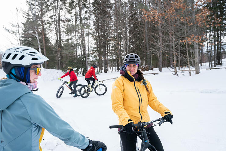 people ride fat bikes in March at the Algoma Highlands Conservancy