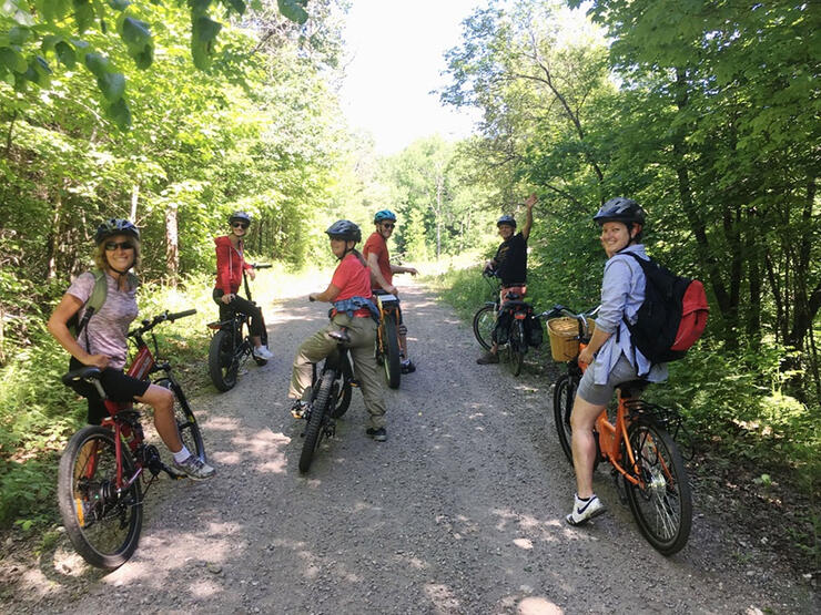 a group of cyclists take a break while on a Yours Outdoors guided tour