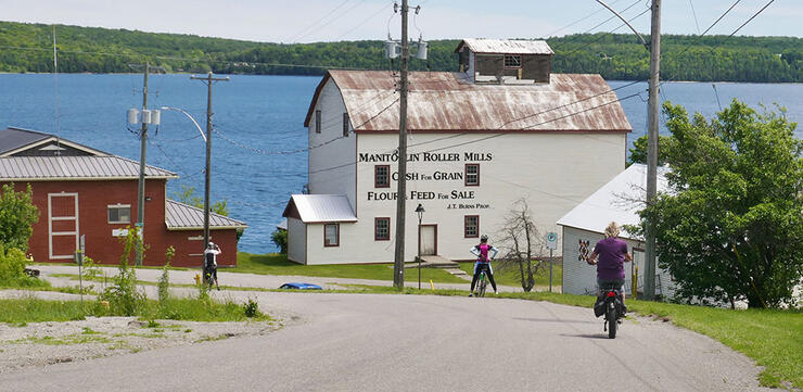 people sightsee while on a Manitoulin cycling tour