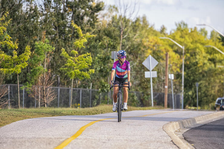 Emily on a paved bike path