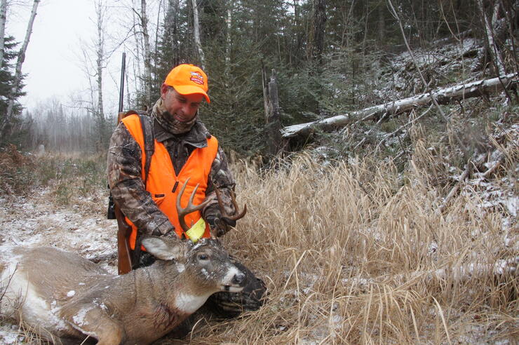 hunter with harvested deer