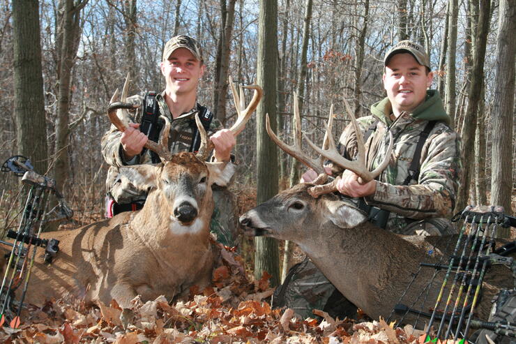 hunters with harvested deer