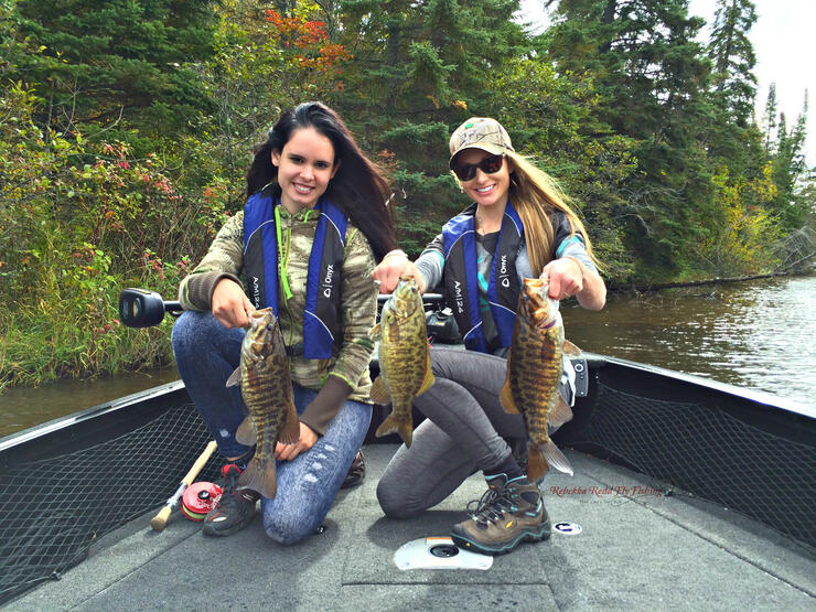 women anglers with bass