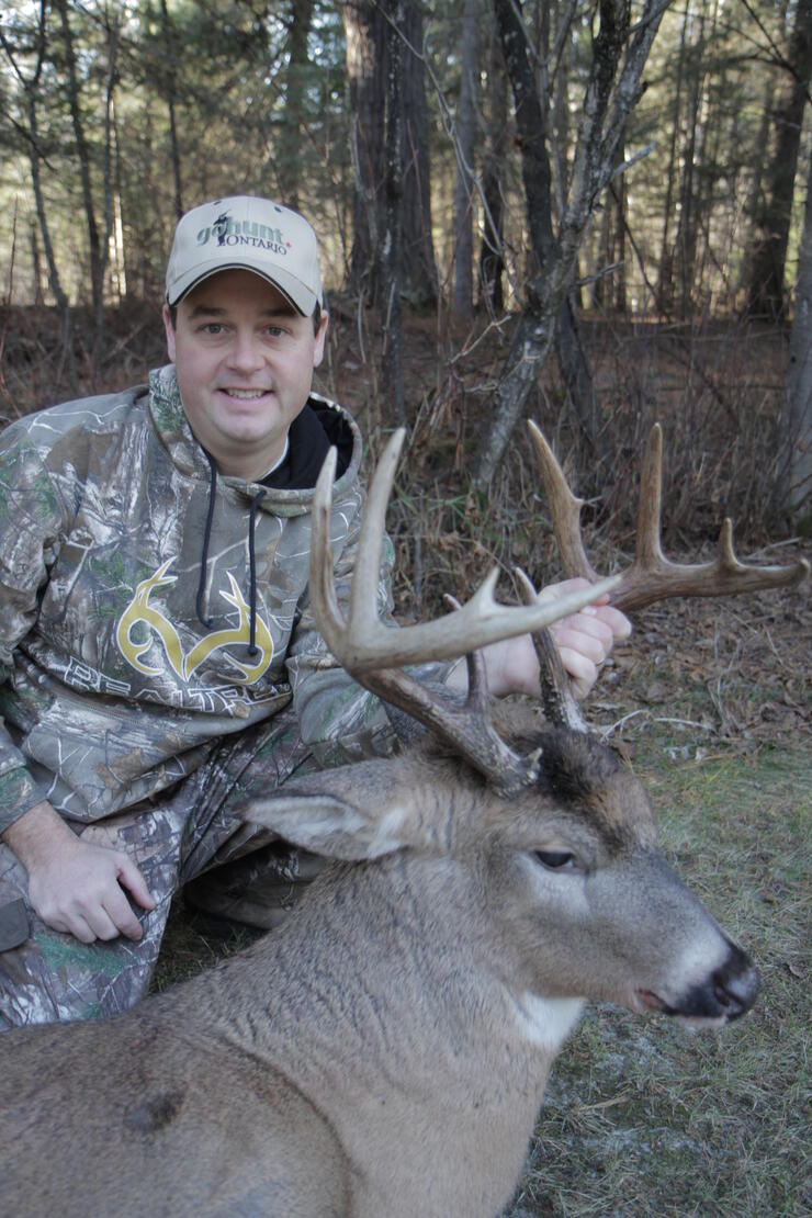 hunter with harvested deer