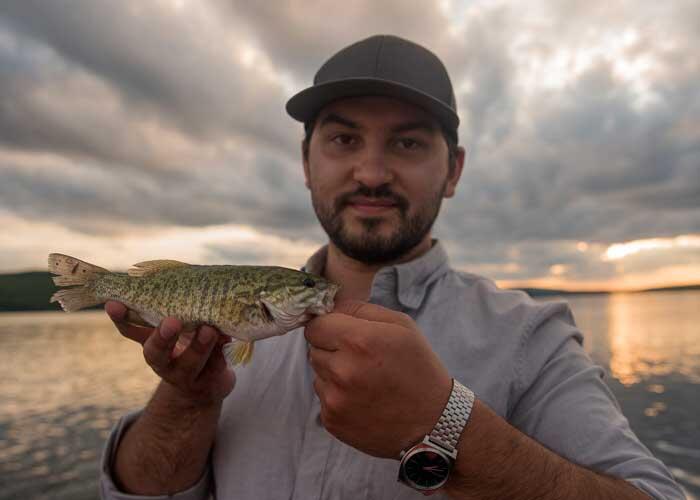 fisherman with smallmouth bass