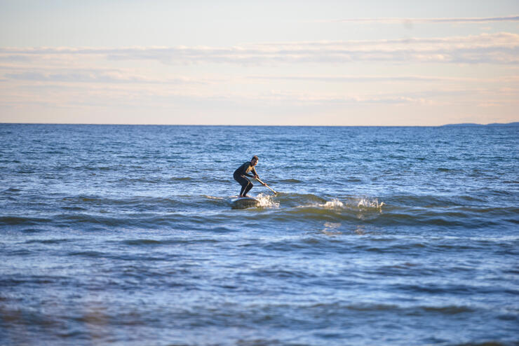 Man surfing on a small wave 