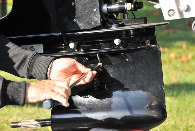 removing screws on the gearcase of a boat