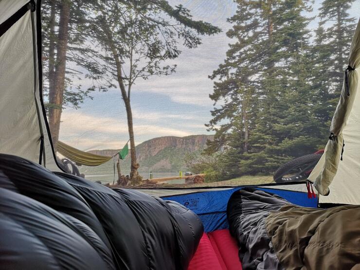 View from the inside of tent to mountain outside