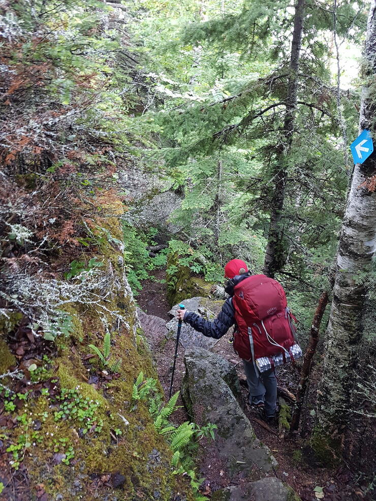 Backpacker traversing difficult terrain