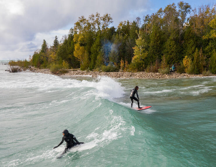 Two people surfing on Lake Huron