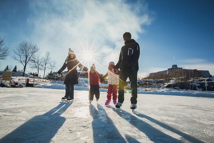 Family skating on an outdoor rink