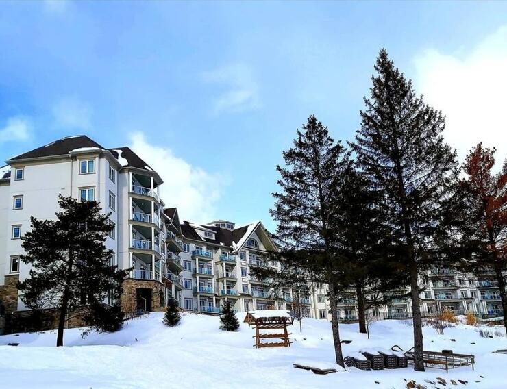 Deerhurst Resort contrasted with a blue sky and white snow