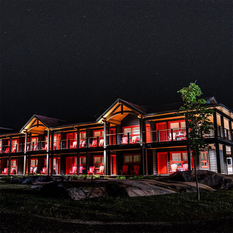 night-time photo of accommodations at Killarney Mountain Lodge