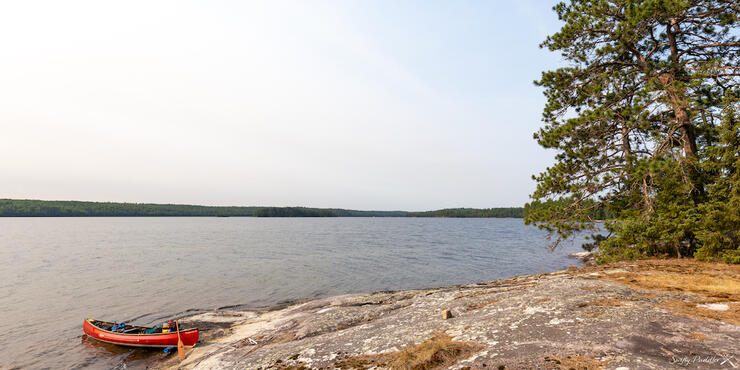 Canoe pulled up on rocky shore