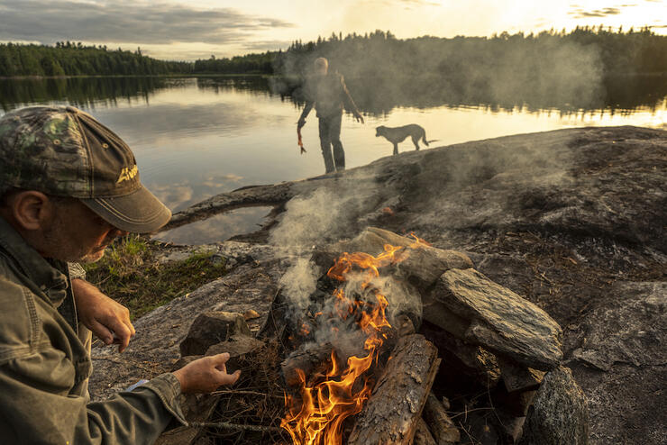 The quintessential Quetico night, with a rocky bluff to situate your fire at sunset and fresh fish ready for the cast iron. Photo: David Jackson