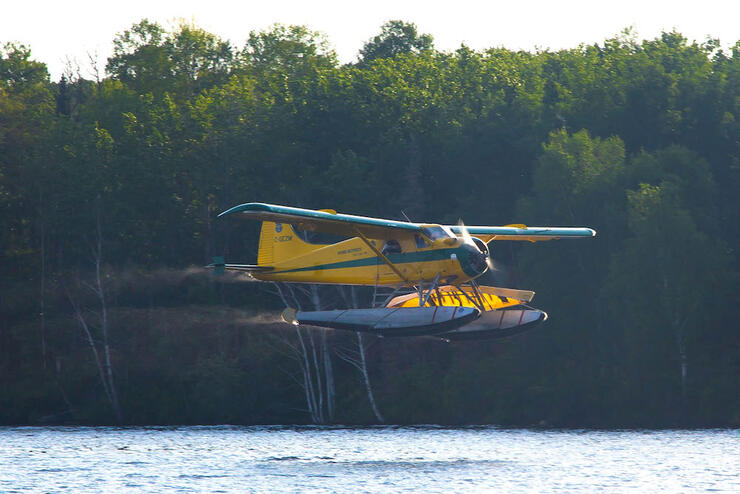 Float plane coming in for a landing on a lake.