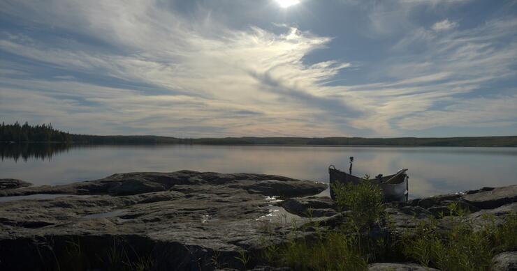 Sky reflected in water on a lake.