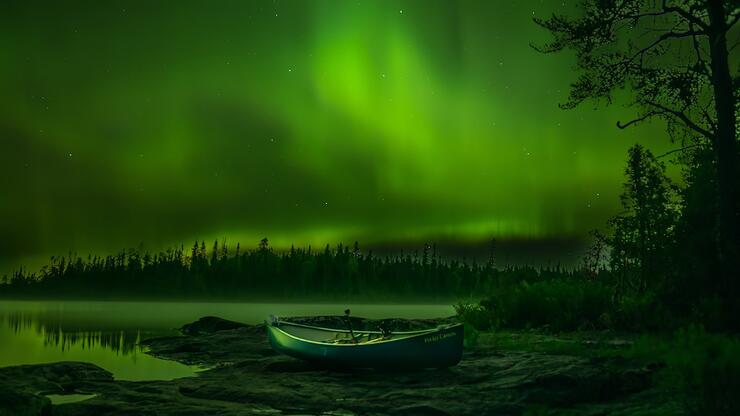 Green Northern Lights over a lake.
