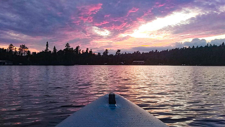 Paddleboarding on Lake Temagami at dusk