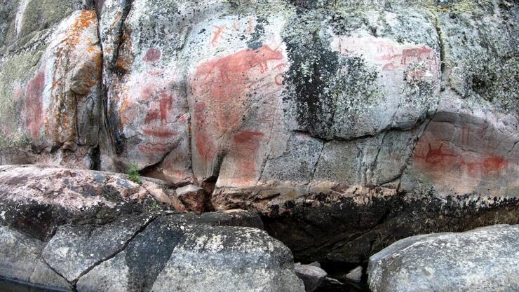 Pictographs on a rock wall.