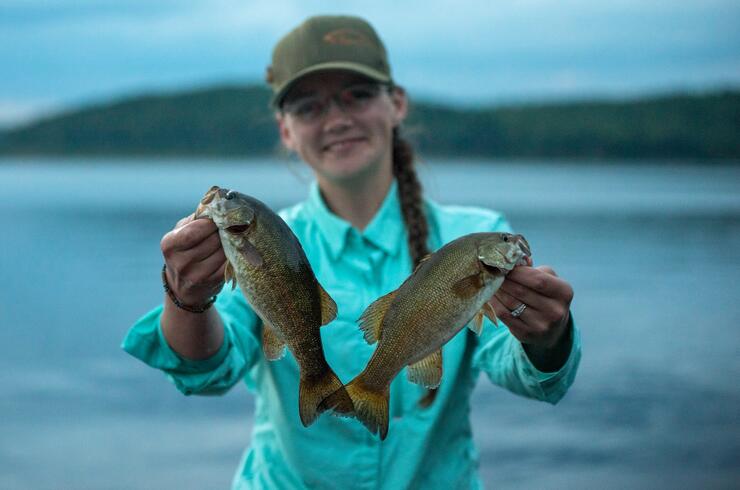 woman angler holding bass