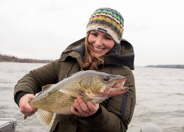 woman angler holding walleye