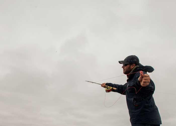 fly fisher casting