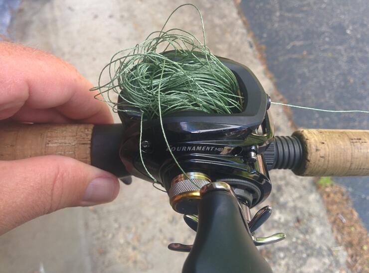 Spooling baitcaster outlet