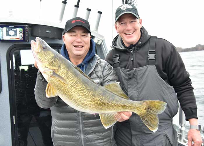2 anglers with walleye