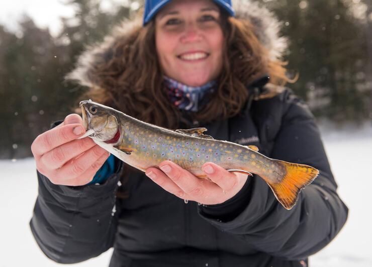 young angler with brook trout