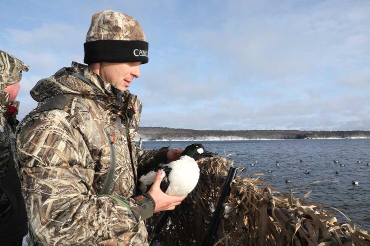 hunter with decoy duck