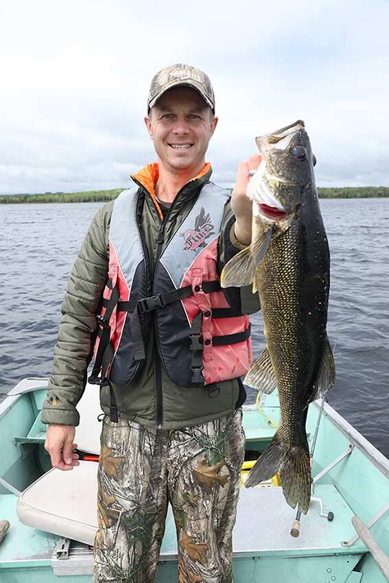 ontario angler holding walleye